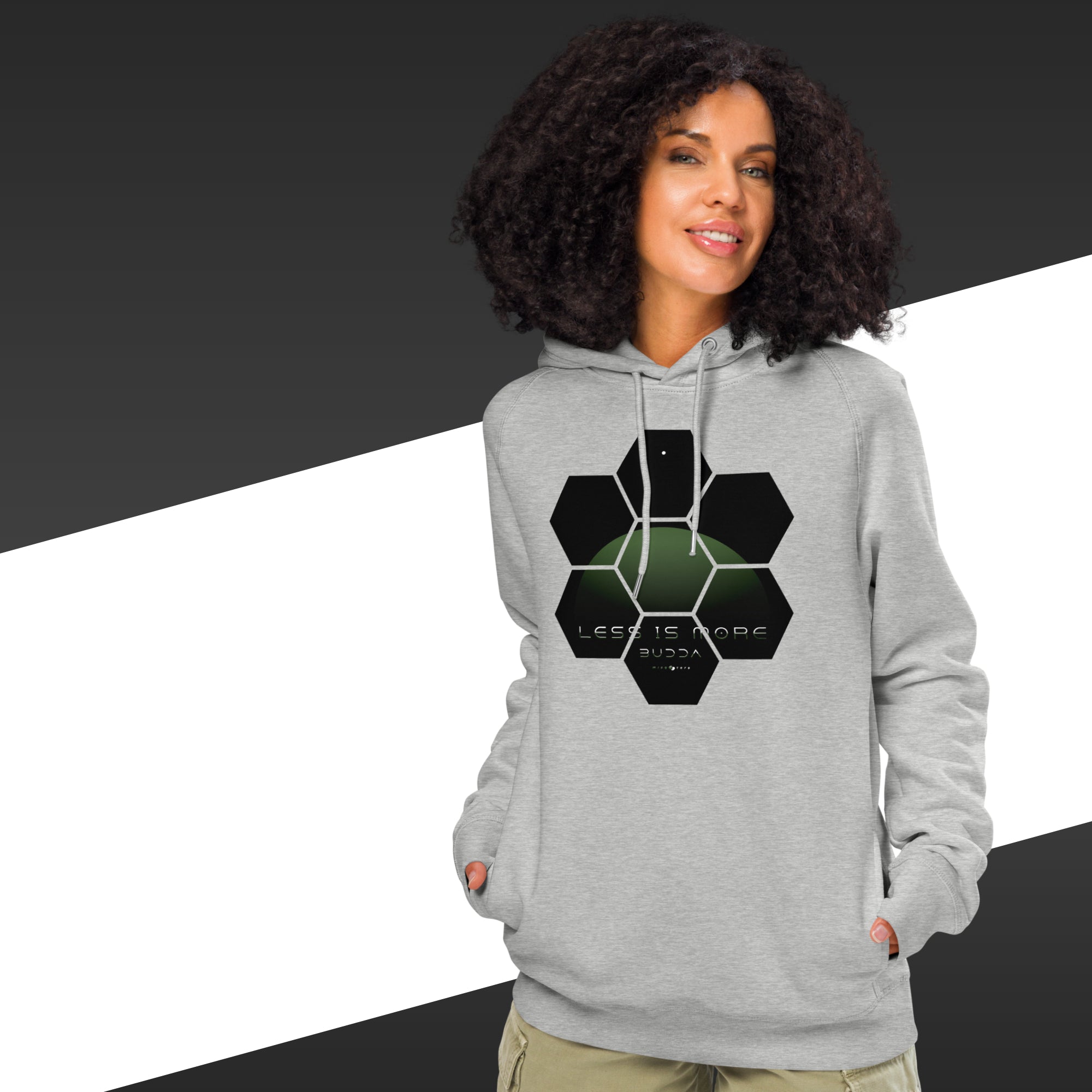 Woman wearing a gray hoodie with a geometric design on a black and white background