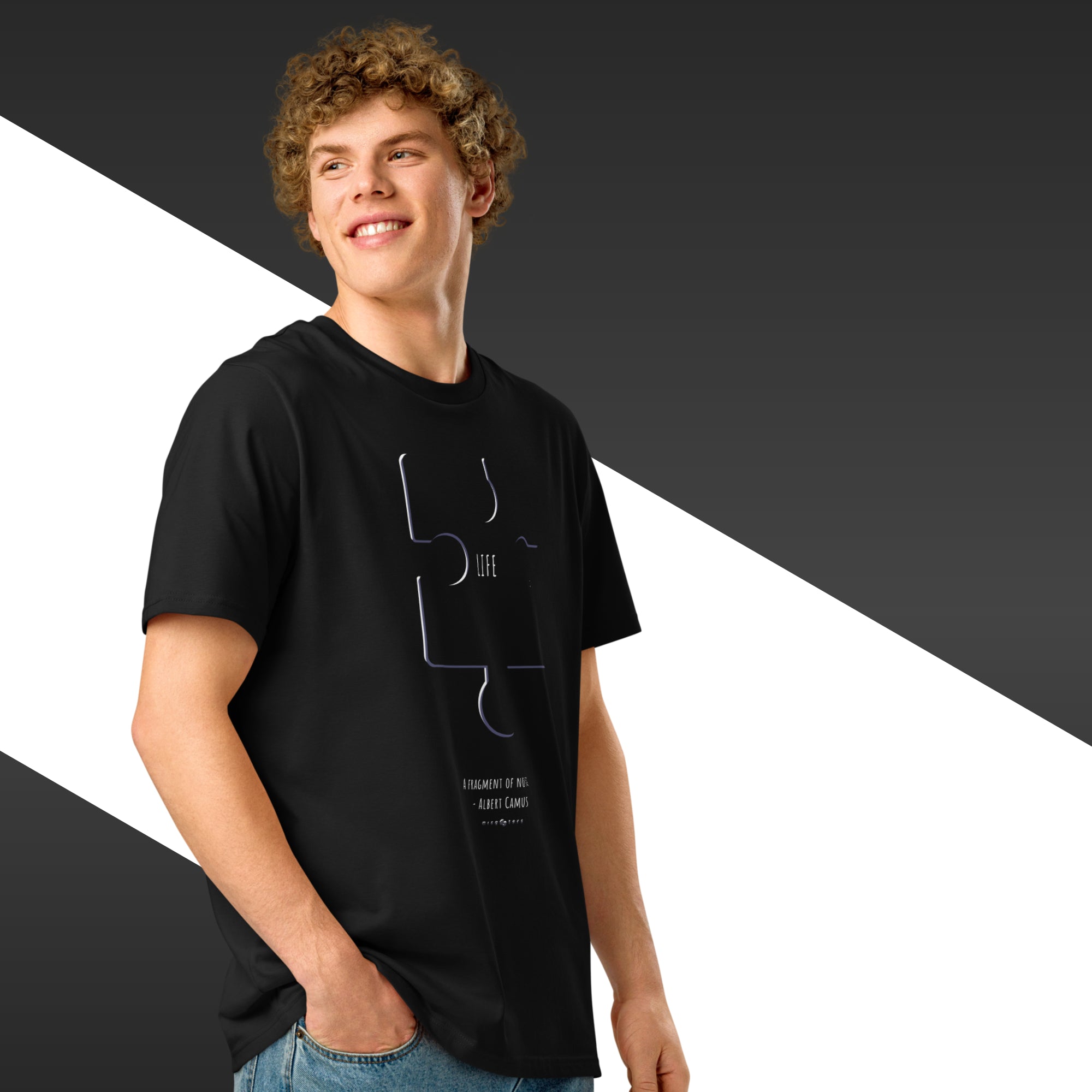 Person wearing a black t-shirt with a graphic design on a black and white background