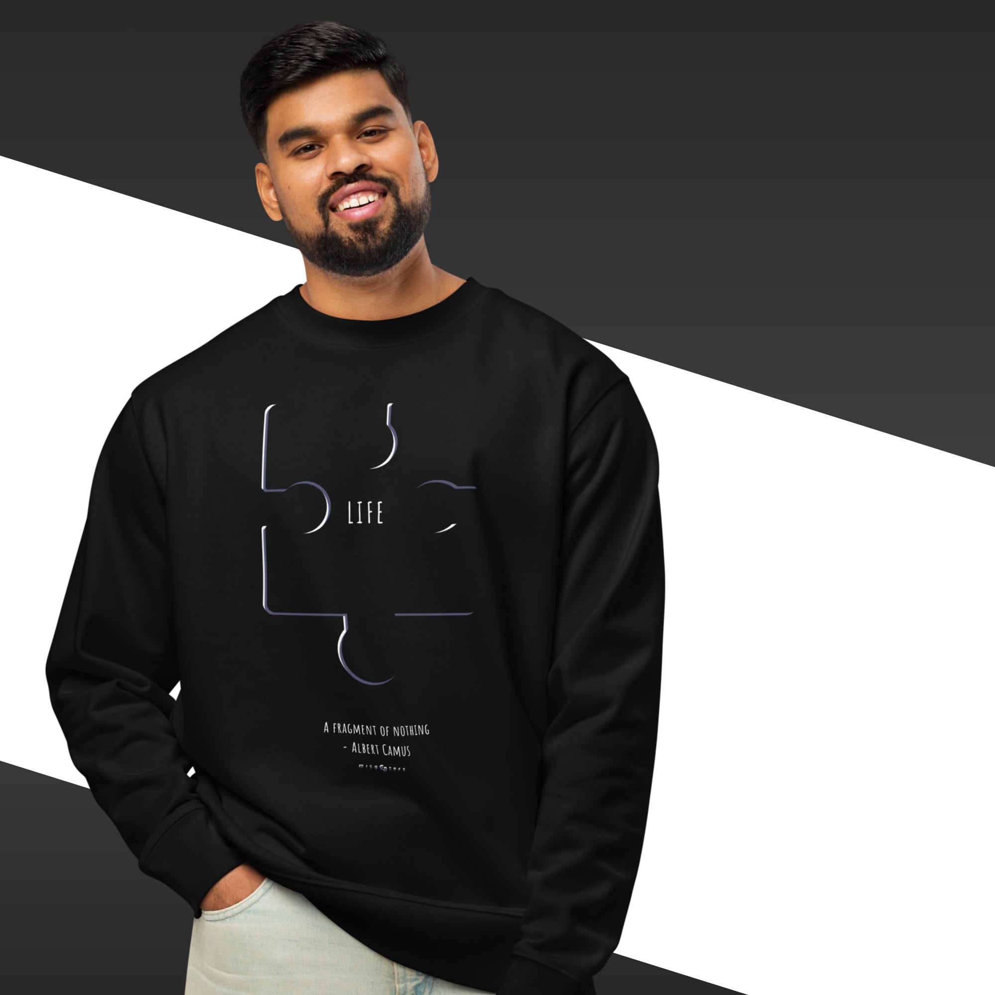 Man wearing a black sweatshirt with a design and text on a white and black background