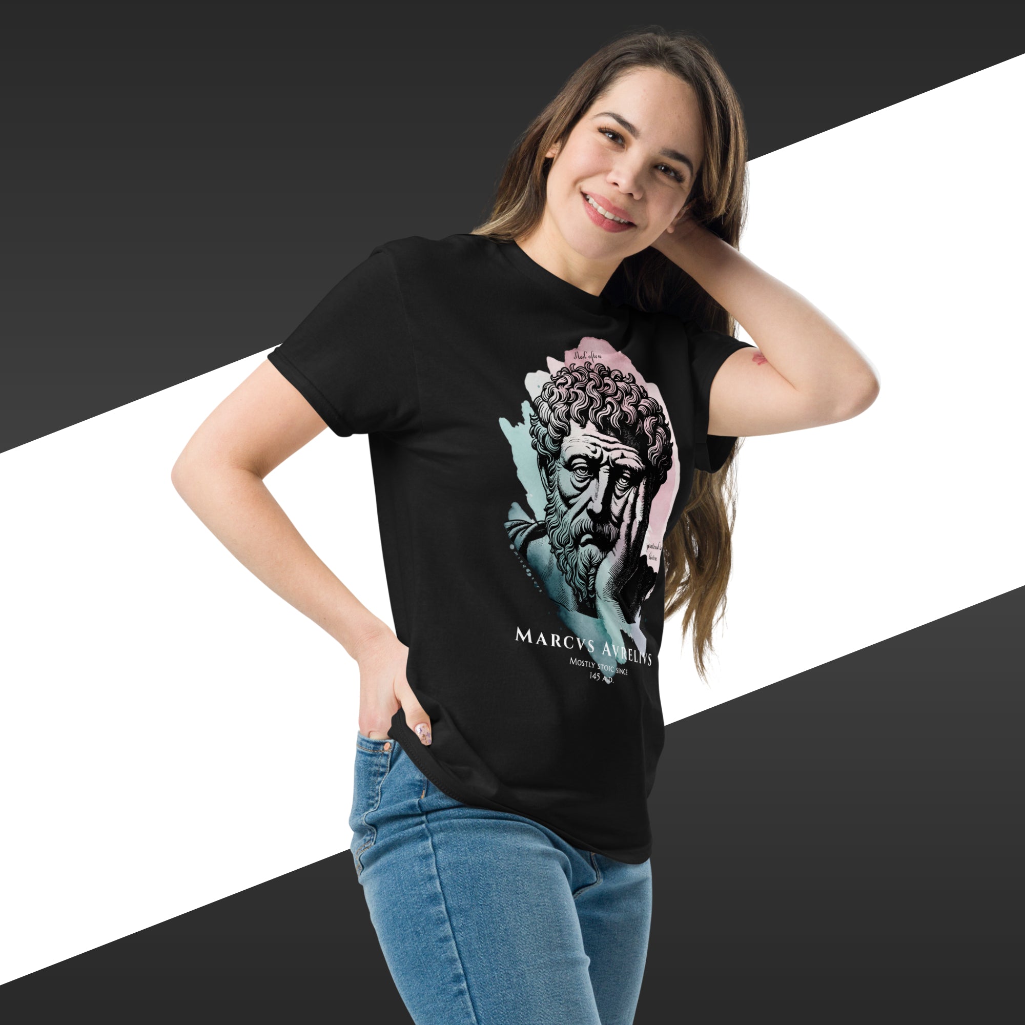 Woman wearing a black t-shirt with a graphic design on a white and black striped background