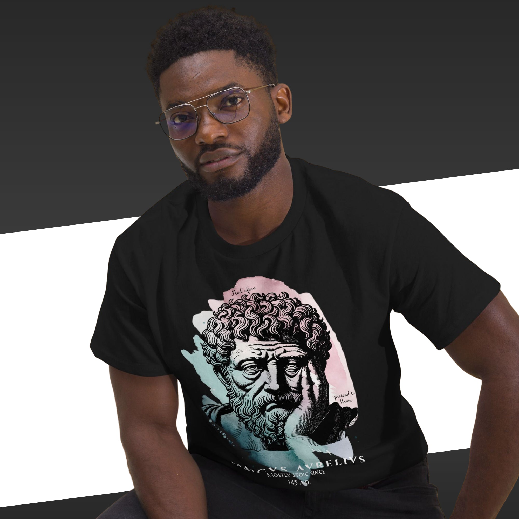 Man wearing a black t-shirt with a graphic design of a classical sculpture.