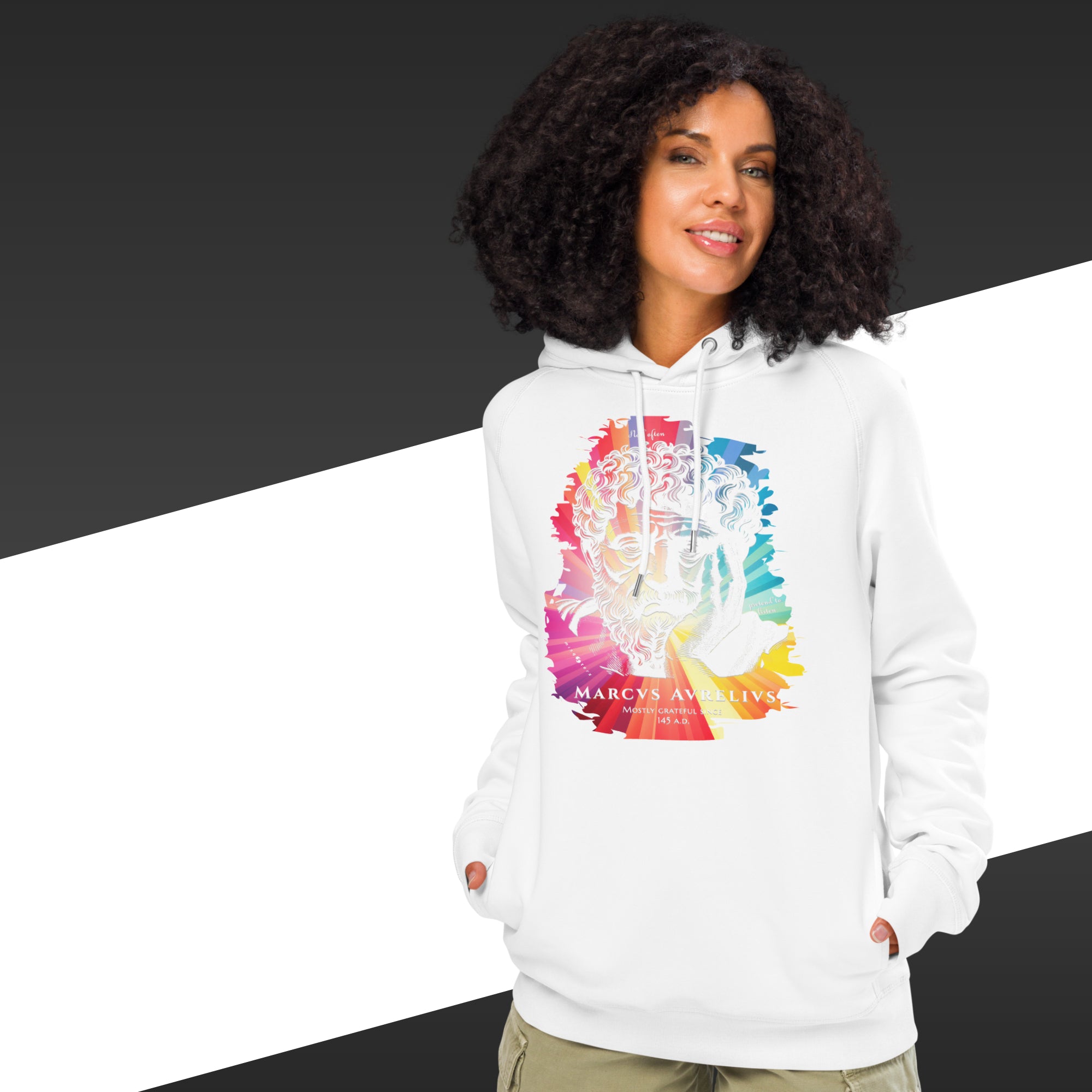 Woman wearing a white hoodie with a colorful graphic design on a black and white background