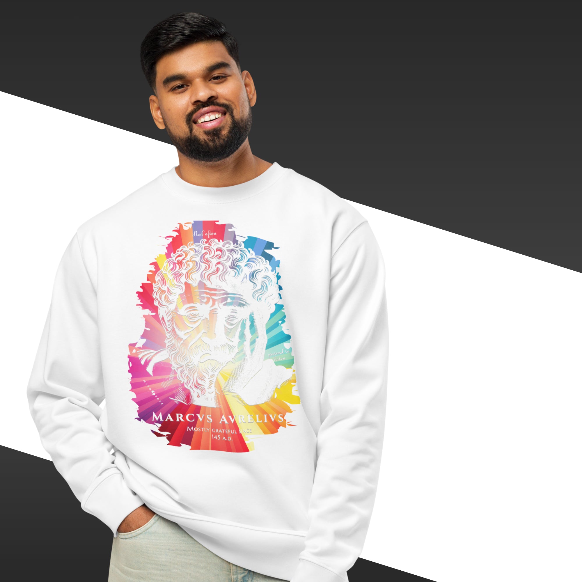 Man wearing a white sweatshirt with a colorful graphic design on a black and white background