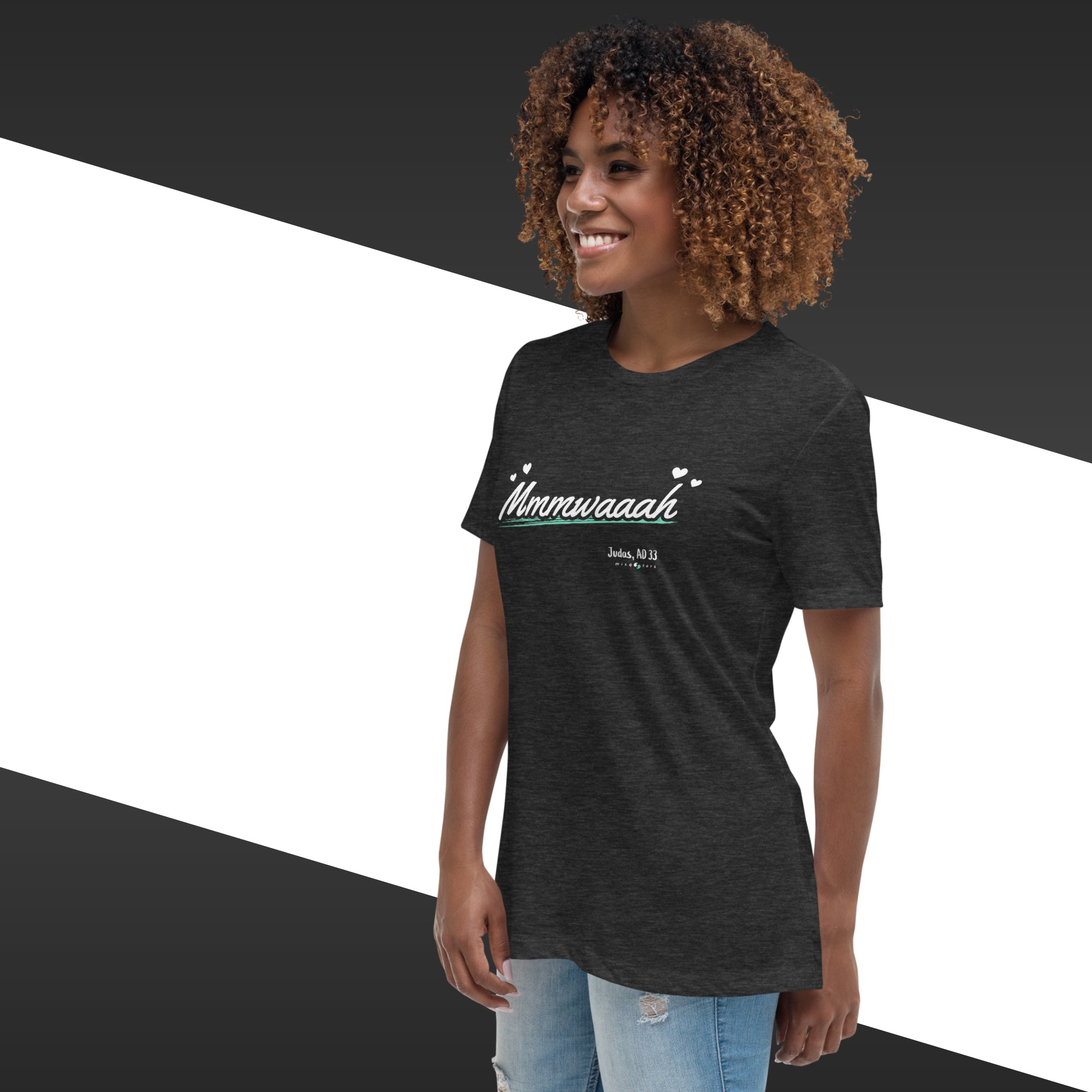 Woman wearing a black t-shirt with text, standing against a black and white geometric background