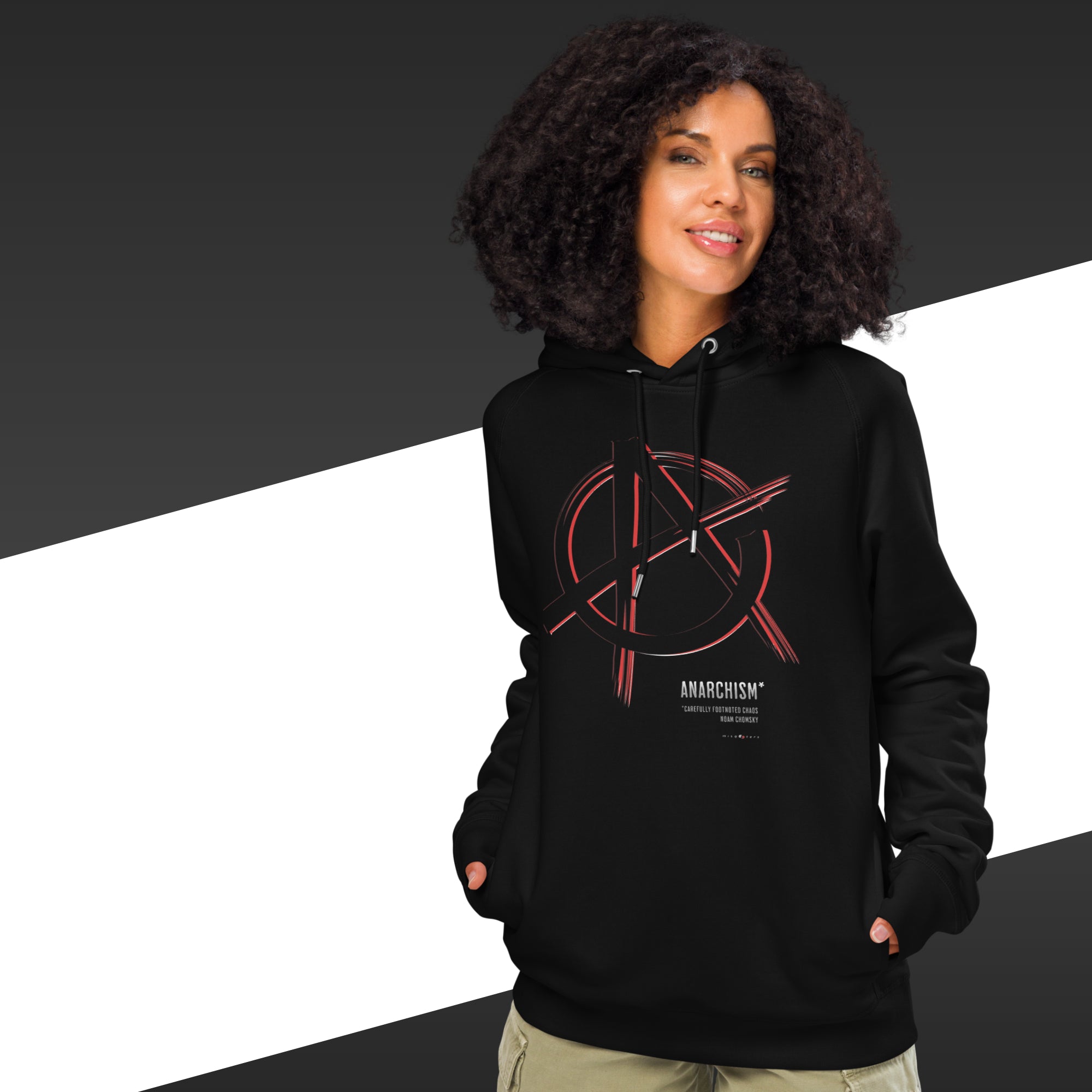 Person wearing a black hoodie with a red and white design on a black and white background