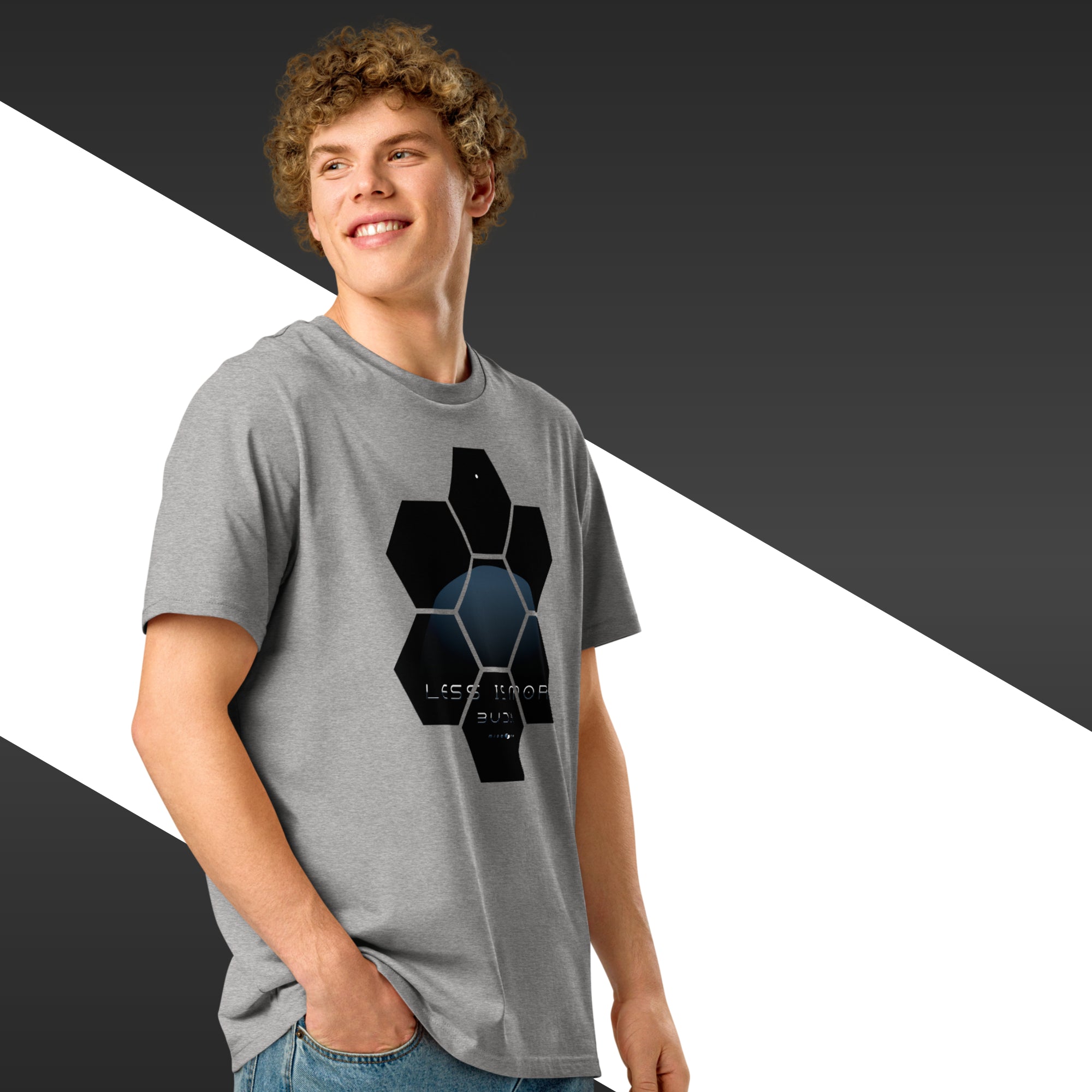 Person wearing a grey t-shirt with a black geometric design on a black and white background