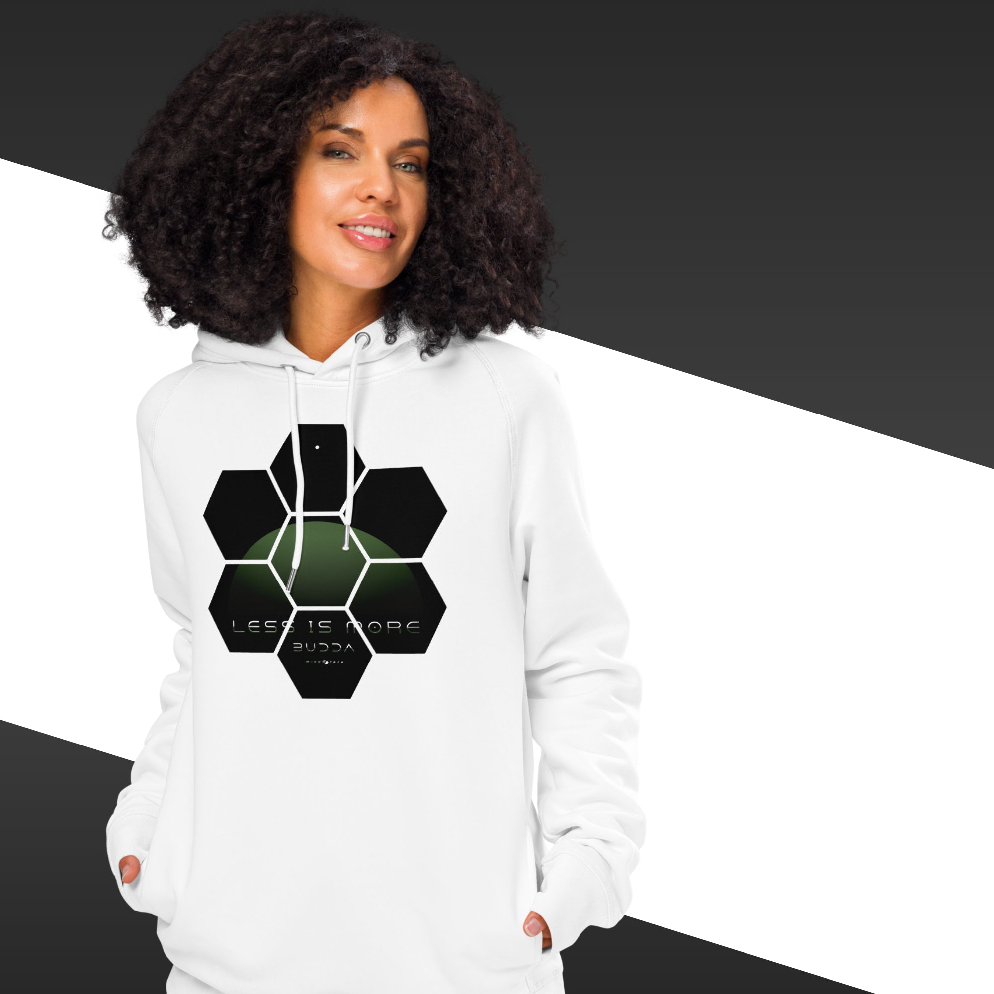 Woman with a white hoodie with a geometrical black and green design and the quote "less is more" from Buddha