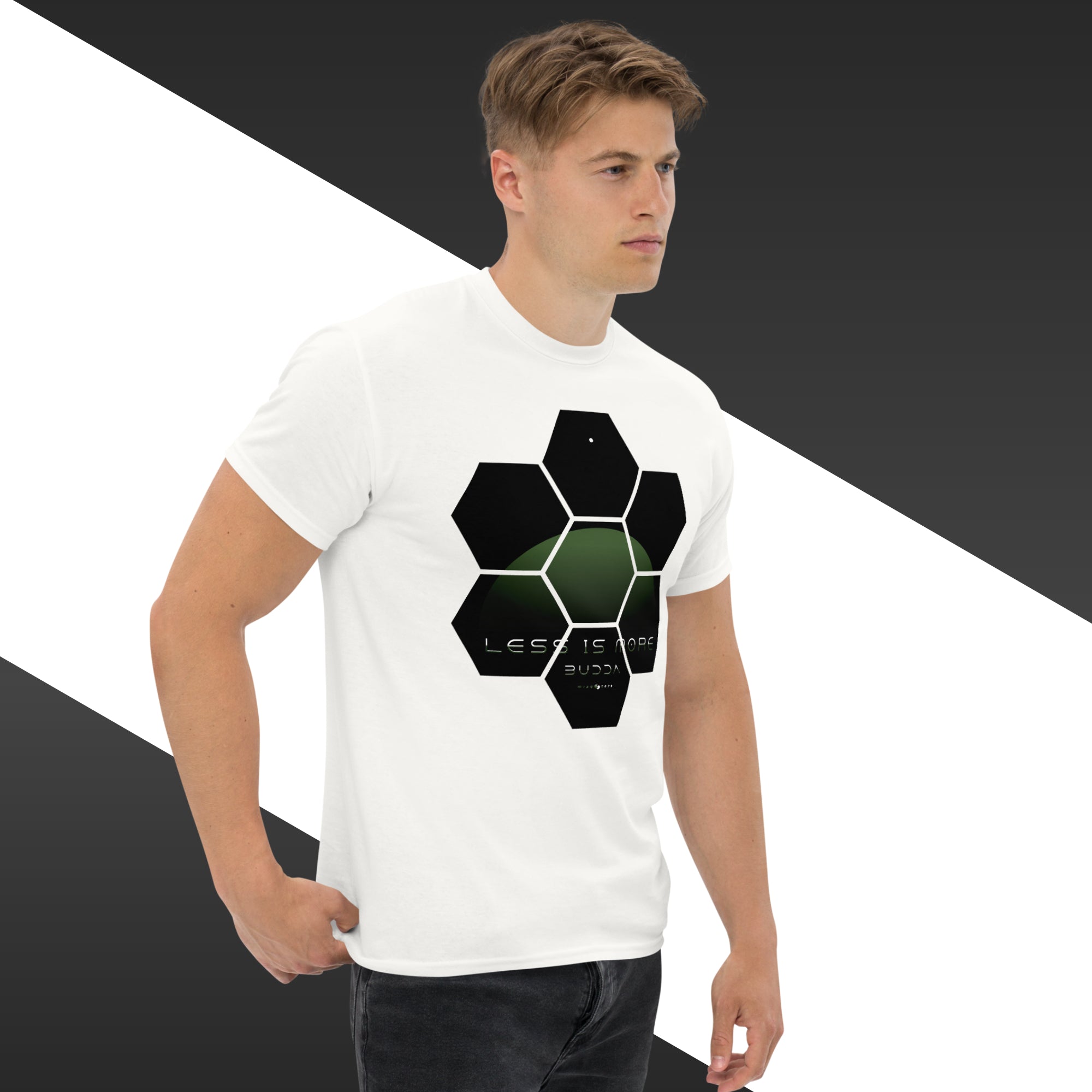 Man wearing a white t-shirt with a black and green geometric design on a black and white background