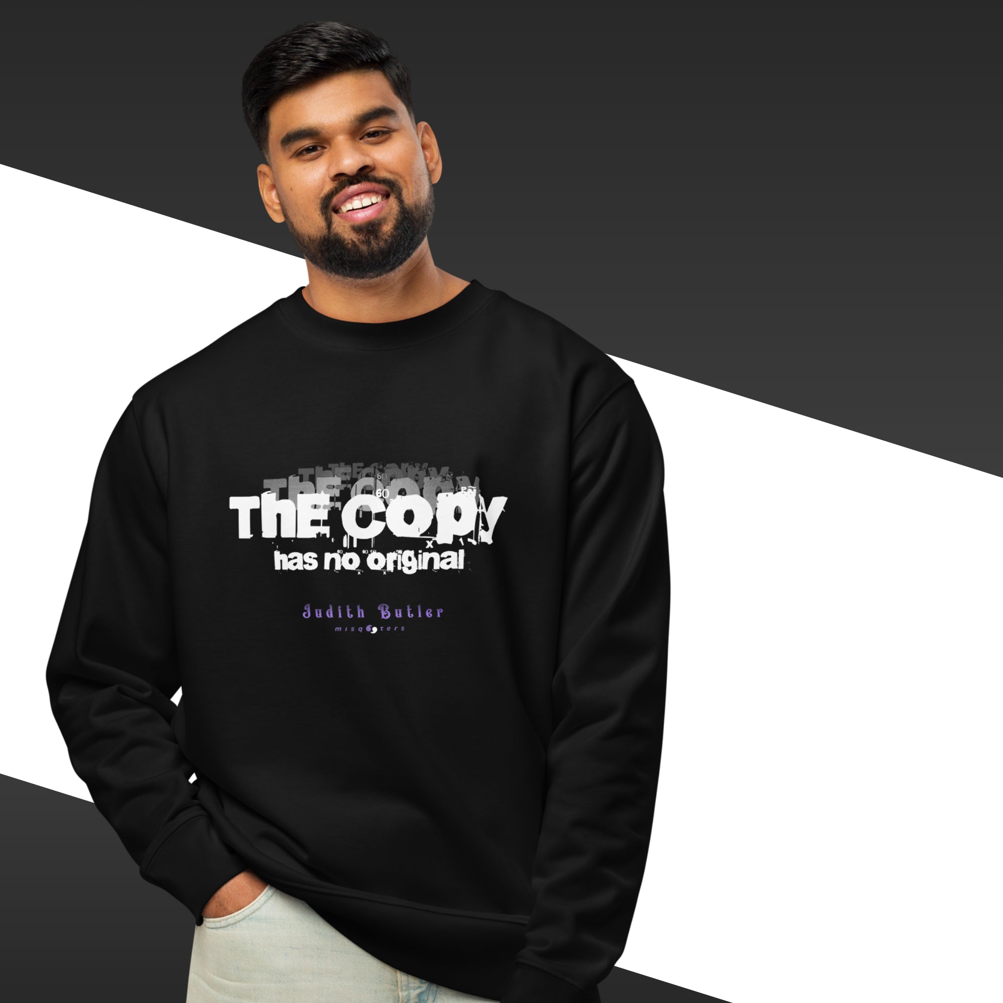 Man wearing a black sweatshirt with text design on a black and white background