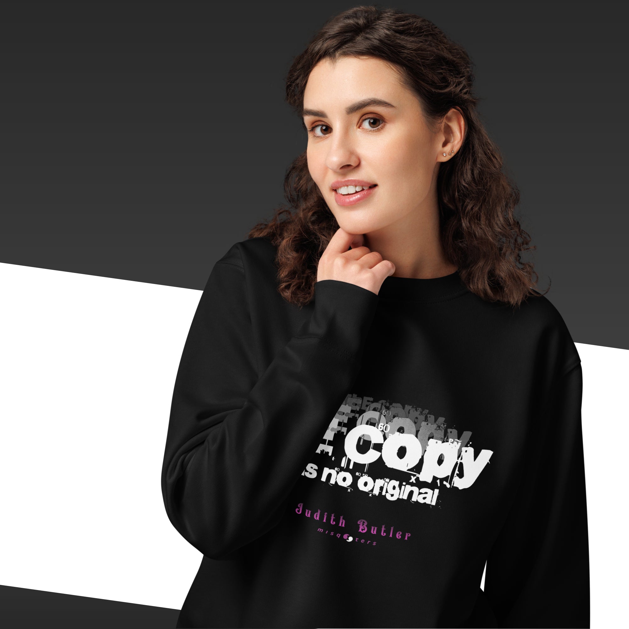 Person wearing a black hoodie with white text on a dark background
