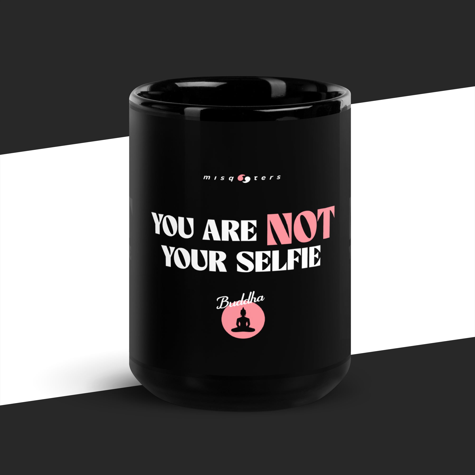 Black mug with motivational quote on a black and white background