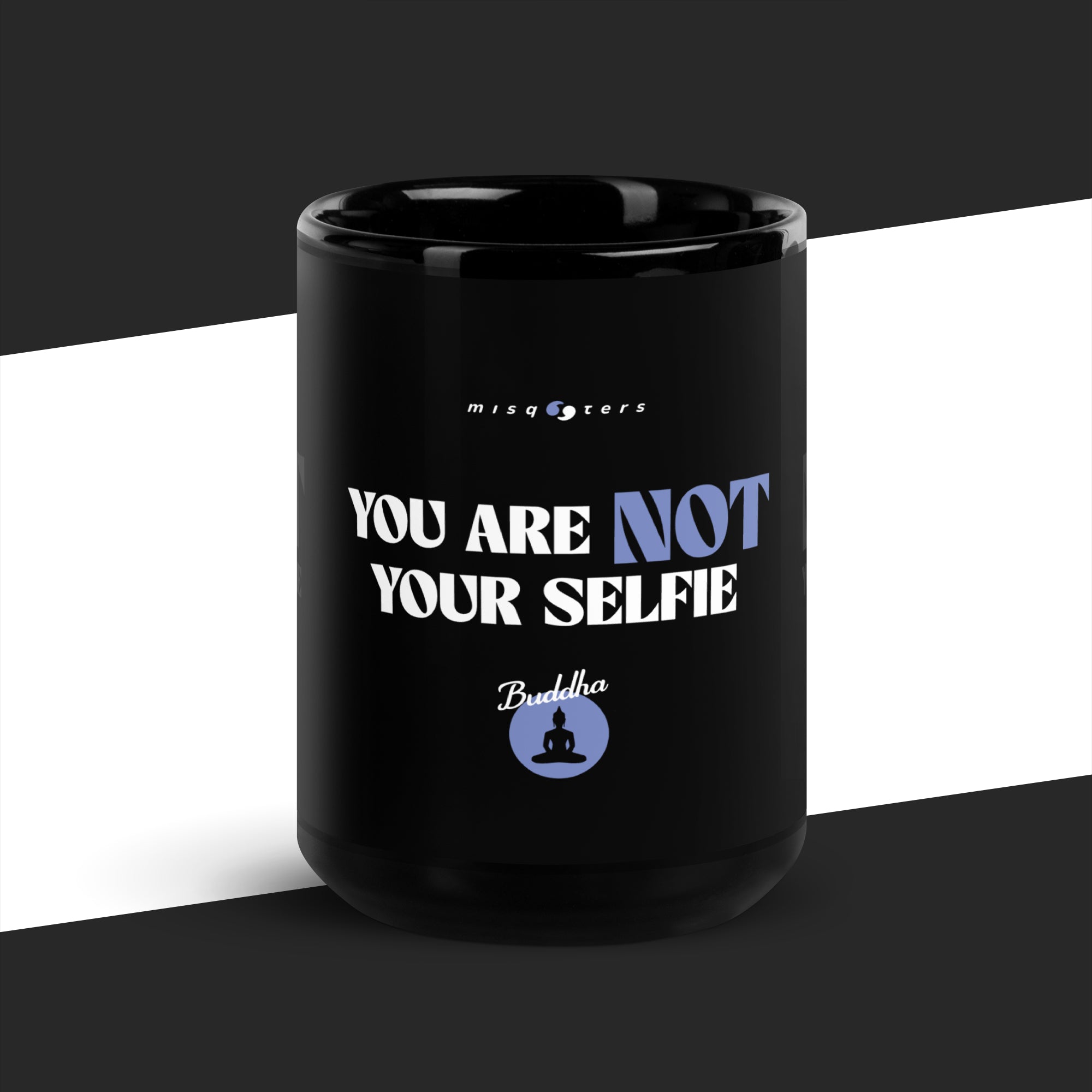 Black mug with motivational quote on a black and white background