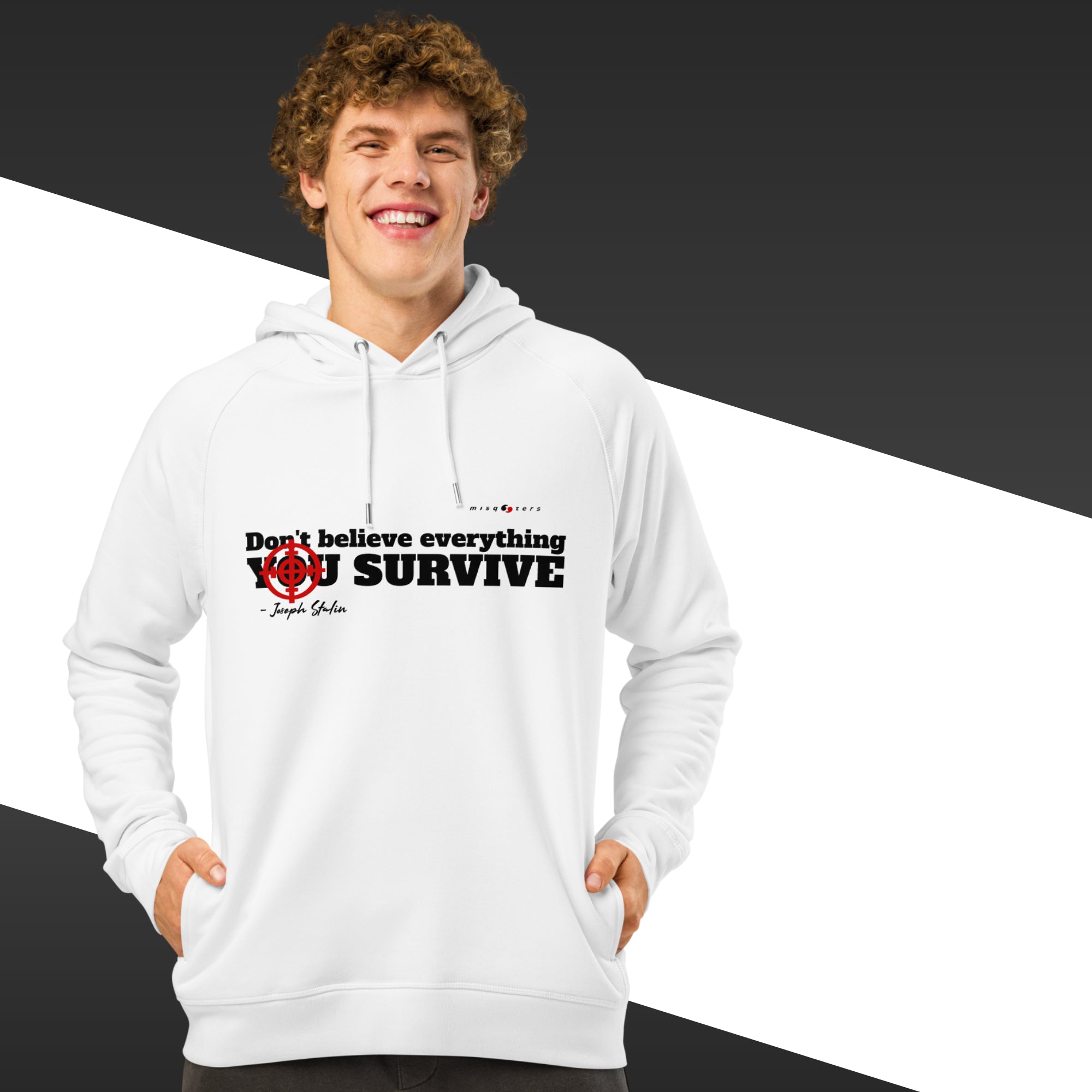 Man with white hoodie with a black text on and in the background there is black and white stripes